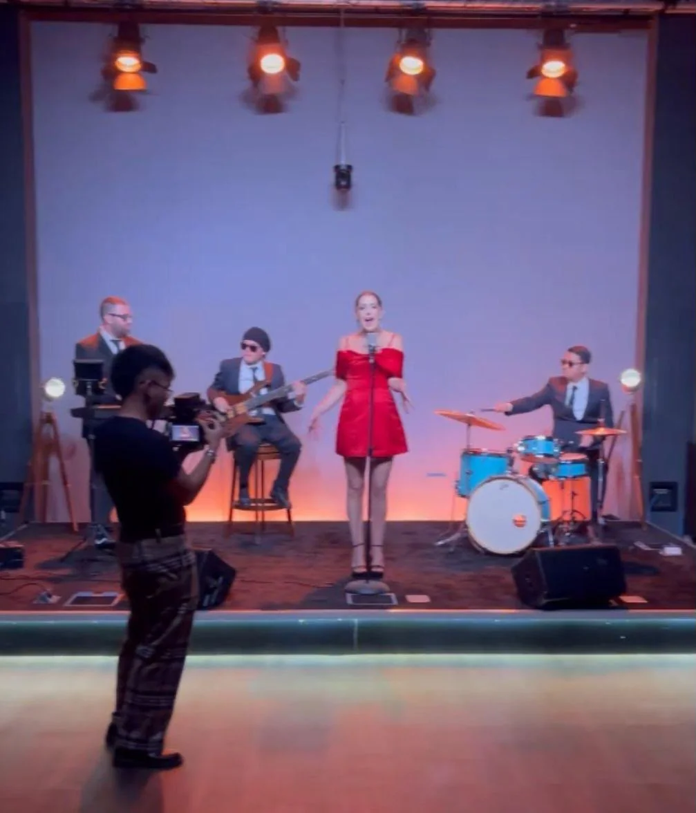 Band performing on the BarCoe Studios stage during filming