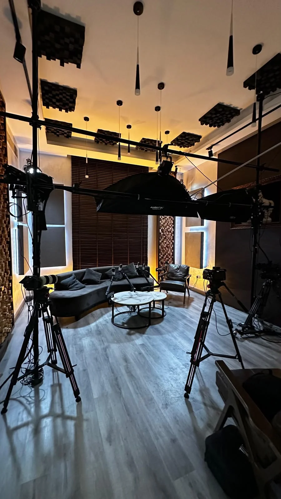Podcast room at BarCoe Studios in Abu Dhabi with sofa, cameras, softboxes and acoustic diffusers